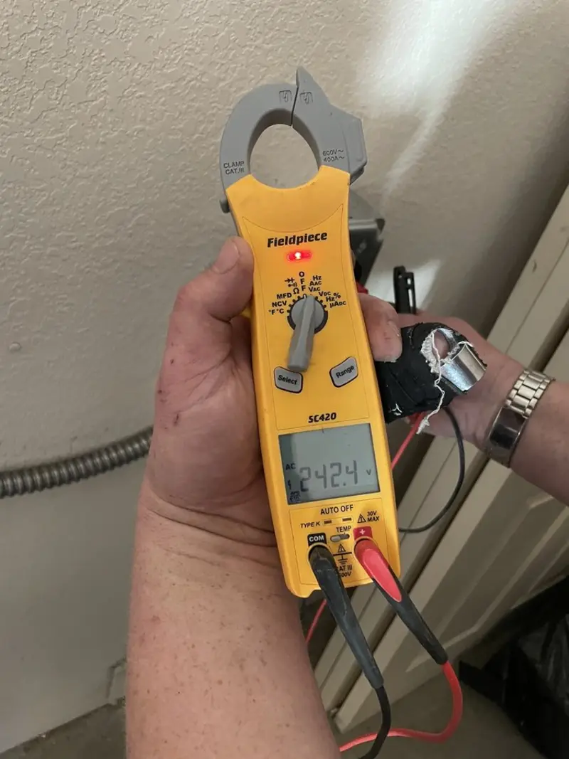 Voltage testing with clamp meter during Outlet Installation in Sandy